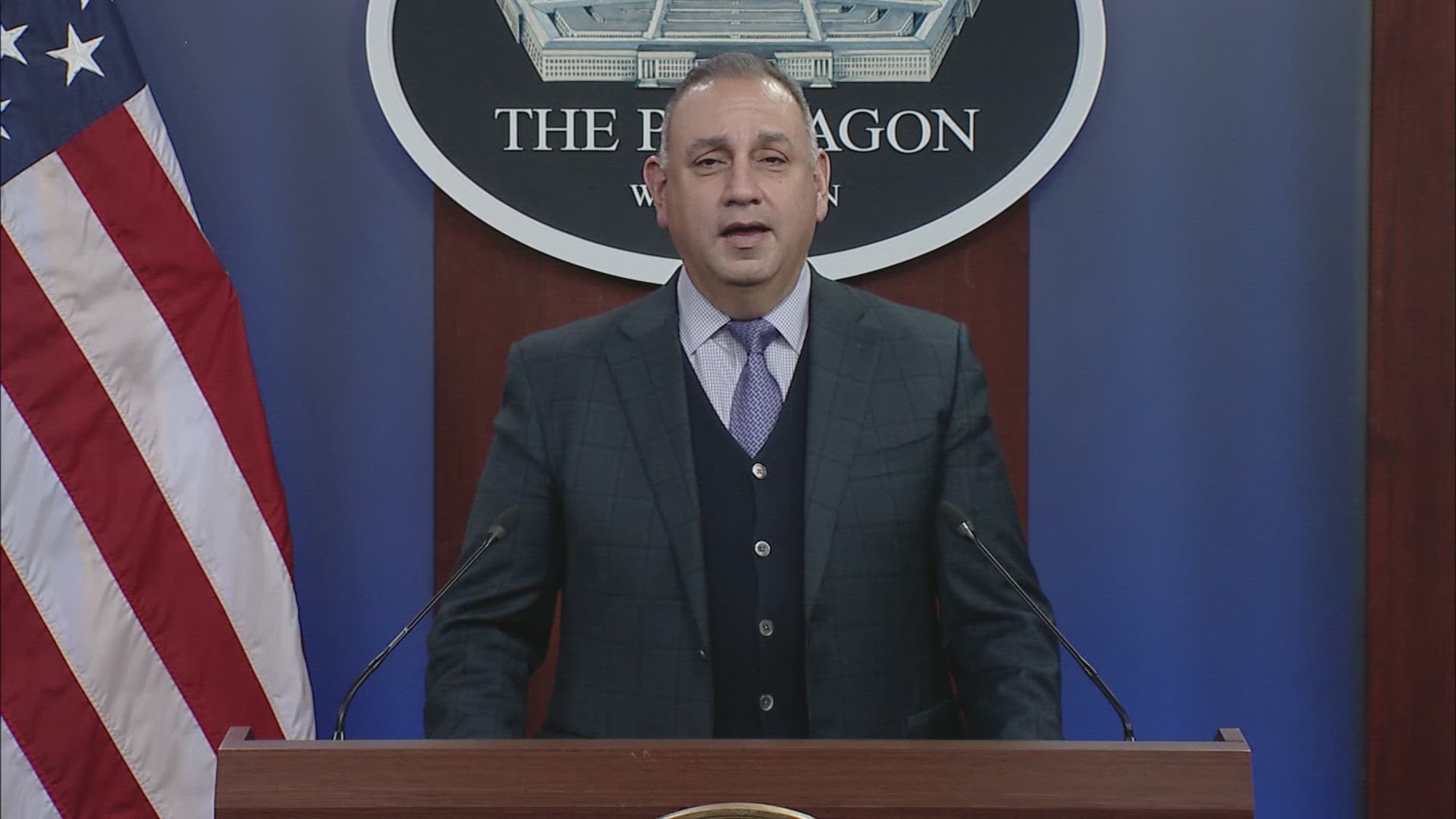Gilbert Cisneros stands at podium in Pentagon Briefing Room.